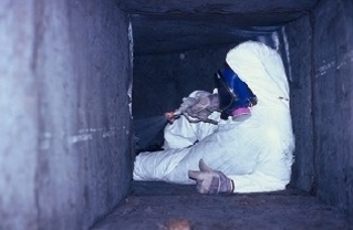 image of an air duct cleaning specialist cleaning an air duct for better air quality
